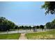 Community tennis court with well-maintained surface and surrounding trees at 17431 Tuscany Ln, Cornelius, NC 28031