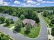 Aerial view of home with mature trees, lush lawns, and sidewalks at 2000 Taney Way, Indian Land, SC 29707