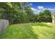 Spacious backyard featuring a well-maintained lawn and lush trees, perfect for outdoor activities and relaxation at 2000 Taney Way, Indian Land, SC 29707