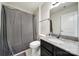 Well-lit bathroom featuring a granite vanity and shower with a gray shower curtain at 2000 Taney Way, Indian Land, SC 29707