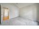 Bedroom with neutral carpet, vaulted ceiling, and doorway view to hall at 2000 Taney Way, Indian Land, SC 29707