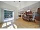 Open-concept dining area connected to the kitchen with a sliding door to the outside at 2000 Taney Way, Indian Land, SC 29707