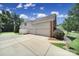 Three-car garage with long driveway and manicured landscaping at 2000 Taney Way, Indian Land, SC 29707