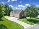 Exterior view of attached three-car garage with large driveway at 2000 Taney Way, Indian Land, SC 29707