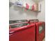 Bright laundry room featuring red washer and dryer units at 2000 Taney Way, Indian Land, SC 29707