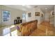 Cozy living room with hardwood floors, comfortable seating, and natural light from multiple windows at 2000 Taney Way, Indian Land, SC 29707