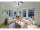 Bright living room with vaulted ceilings, large windows, and comfortable seating arrangements at 2000 Taney Way, Indian Land, SC 29707
