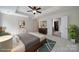 Staged bedroom featuring tray ceilings, and an en-suite bathroom with a walk-in closet at 2000 Taney Way, Indian Land, SC 29707