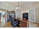 Spacious office with large wooden desk, hardwood floors, shelving, and french doors at 2000 Taney Way, Indian Land, SC 29707