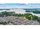 Stunning aerial view of lakeside community featuring lush greenery, swimming pool, and beautiful water views at 2369 Stardust Ct, Denver, NC 28037