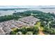 Beautiful aerial view of a home in a community near a lake, surrounded by lush green trees and landscaping at 2369 Stardust Ct, Denver, NC 28037
