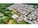 Aerial view of a neighborhood with a pool, tennis court, clubhouse, and the home outlined in red at 2369 Stardust Ct, Denver, NC 28037