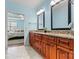 Spacious bathroom with double vanity, granite countertops, and a view of the luxurious bedroom, creating a spa-like experience at 2369 Stardust Ct, Denver, NC 28037