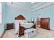 Elegant bedroom featuring a coffered ceiling, wooden bed, with a view to ensuite bathroom at 2369 Stardust Ct, Denver, NC 28037