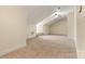 Spacious bonus room with neutral carpet, dormered ceiling and ceiling fan offers versatility and comfort at 2369 Stardust Ct, Denver, NC 28037