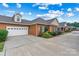 Brick home with an attached garage and beautiful landscaping creates an inviting facade at 2369 Stardust Ct, Denver, NC 28037