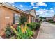 The exterior showcases brickwork, flowerbeds with blooming plants, and window shutters at 2369 Stardust Ct, Denver, NC 28037