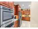 Chef's kitchen showcasing stainless appliances, custom cabinetry, and granite countertops at 2369 Stardust Ct, Denver, NC 28037