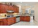 Gourmet kitchen featuring granite countertops, tiled backsplash, and stainless steel appliances at 2369 Stardust Ct, Denver, NC 28037