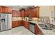 Kitchen featuring stainless steel appliances, stone backsplash, granite countertops, and wood cabinetry at 2369 Stardust Ct, Denver, NC 28037