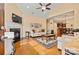 Spacious living room boasts hardwood floors, a fireplace, and modern decor at 2369 Stardust Ct, Denver, NC 28037