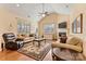 The living room is filled with neutral decor, hardwood floors, and a cozy fireplace at 2369 Stardust Ct, Denver, NC 28037