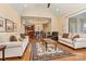 Open concept living room featuring hardwood floors, neutral paint, and access to kitchen and dining area at 2369 Stardust Ct, Denver, NC 28037