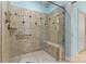 Modern shower features decorative tile, glass door, built-in bench, and convenient grab bar for safety and style at 2369 Stardust Ct, Denver, NC 28037