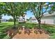 Spacious backyard features a healthy lawn, patio and an inviting fire pit at 25391 Seagull Dr, Lancaster, SC 29720