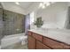 Well-lit bathroom featuring a tub and shower combination and a vanity with a white countertop at 25391 Seagull Dr, Lancaster, SC 29720