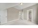 Bright upstairs bedroom featuring carpet, white trim, and access to other rooms at 25391 Seagull Dr, Lancaster, SC 29720