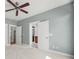 Bedroom with neutral walls, white trim, carpet, and an open door leading to a bathroom at 25391 Seagull Dr, Lancaster, SC 29720