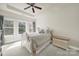 Bright bedroom featuring neutral decor, ample windows, and a ceiling fan at 25391 Seagull Dr, Lancaster, SC 29720
