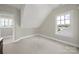 Bright bedroom featuring neutral walls and carpet plus natural light from two windows at 25391 Seagull Dr, Lancaster, SC 29720