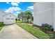 Long driveway leading to a detached garage and a well-manicured lawn at 25391 Seagull Dr, Lancaster, SC 29720