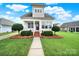 Inviting home with manicured front yard, walkway, and covered front porch at 25391 Seagull Dr, Lancaster, SC 29720