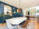 Stylish dining room with a stone-topped table, unique lighting, and hardwood floors at 2553 Elkwood Cir, Charlotte, NC 28205