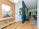 Stylish foyer boasting hardwood floors, wooden wall decor, and open layout with views of the living space at 2553 Elkwood Cir, Charlotte, NC 28205