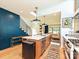 Modern kitchen featuring a large island, wooden cabinets, and an open layout with great natural light at 2553 Elkwood Cir, Charlotte, NC 28205