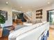 Inviting living room showcasing an open layout, with a view to the modern kitchen and stairway at 2553 Elkwood Cir, Charlotte, NC 28205