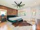 Stylish main bedroom with panel accents, modern furniture, and plenty of natural light from multiple windows at 2553 Elkwood Cir, Charlotte, NC 28205
