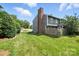 The private backyard features lush lawn and mature trees at 3020 Heathstead Pl # A, Charlotte, NC 28210