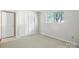 Bright bedroom with a window for natural light and a closet at 3020 Heathstead Pl # A, Charlotte, NC 28210
