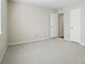 This carpeted bedroom has multiple white doors at 3020 Heathstead Pl # A, Charlotte, NC 28210