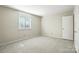 This carpeted bedroom has a window on the wall at 3020 Heathstead Pl # A, Charlotte, NC 28210
