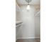 This walk-in closet features shelving and a light fixture at 3020 Heathstead Pl # A, Charlotte, NC 28210