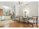 An open dining area connecting to the modern kitchen at 3020 Heathstead Pl # A, Charlotte, NC 28210