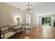 Inviting dining room with hardwood floors and modern lighting fixture at 3020 Heathstead Pl # A, Charlotte, NC 28210