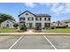 Exterior view of building with black shutters and trim, featuring a brick walkway and landscaping at 3020 Heathstead Pl # A, Charlotte, NC 28210
