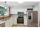 Well-lit kitchen with stainless steel appliances and sleek countertops at 3020 Heathstead Pl # A, Charlotte, NC 28210